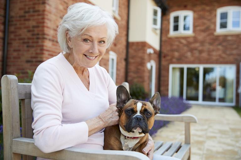 an older woman and a bulldog with sagging jowls